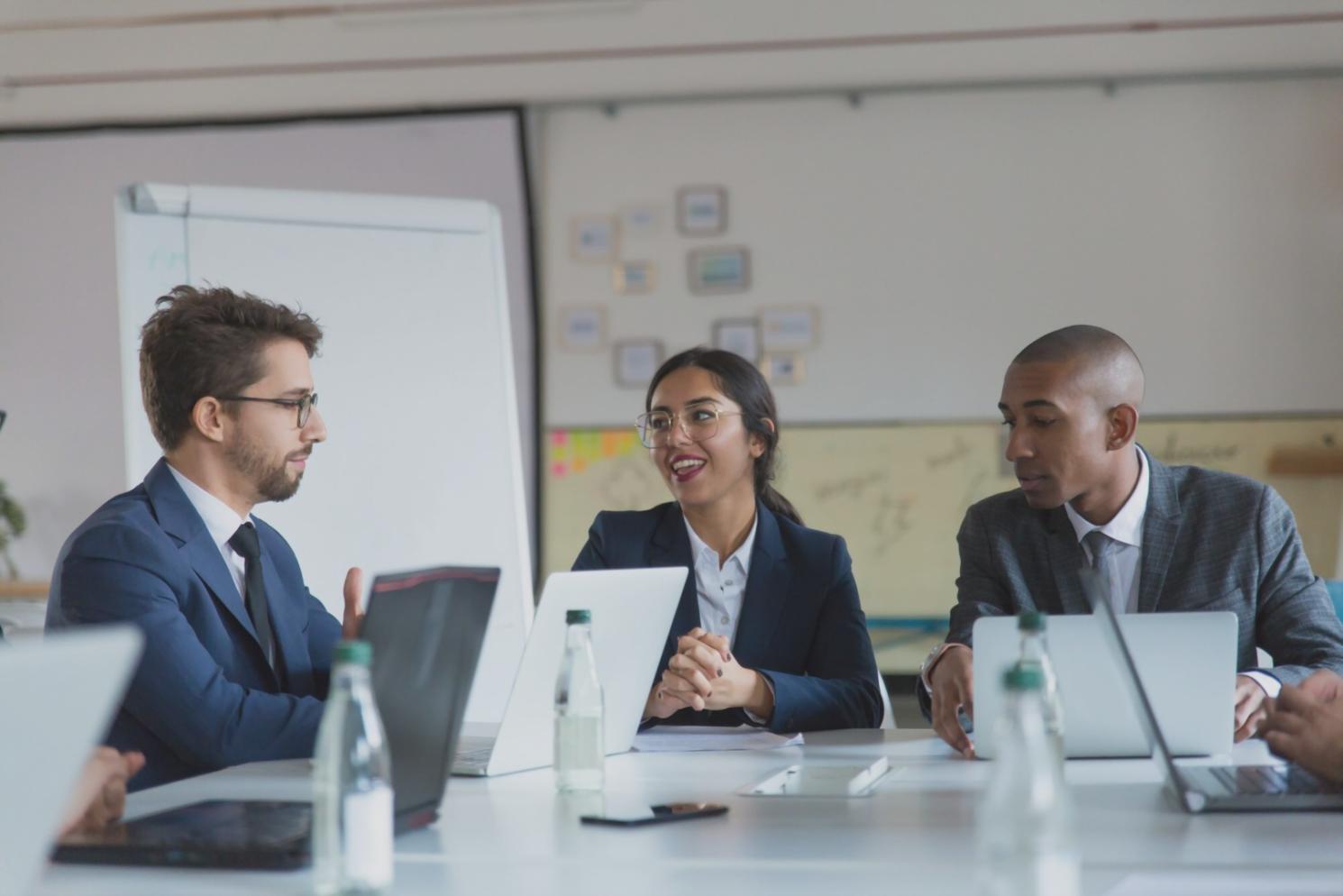 Modern classroom setting with business owners engaged in financial planning workshop
